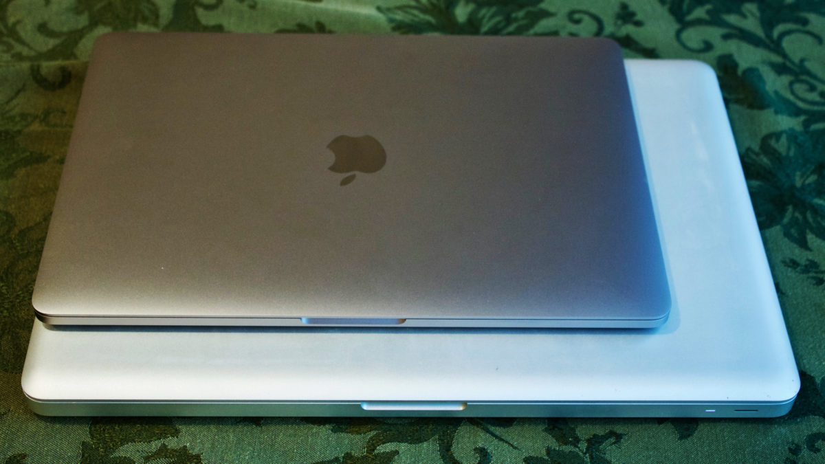 Old and new laptops in a stack on my Christmas tablecloth